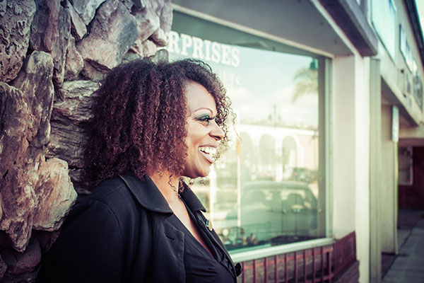 Woman Smiling In Front Of Store
