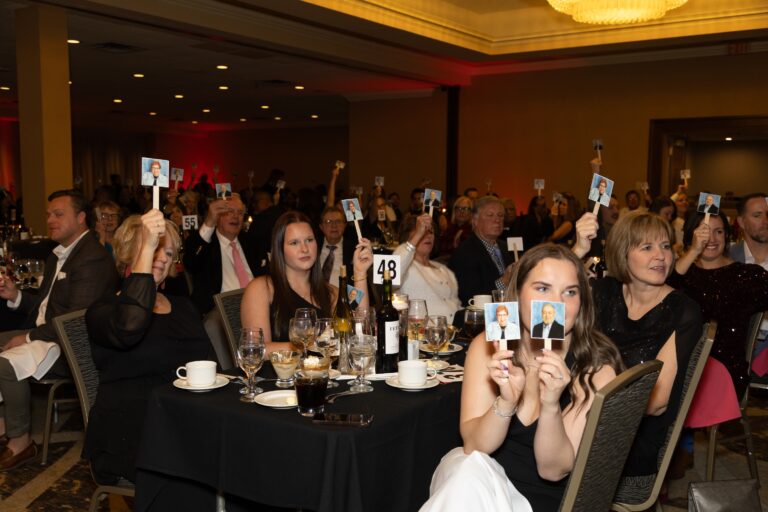 Guests seated at Stand Up for Synergy 2026